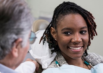 Female patient smiling at her dentist