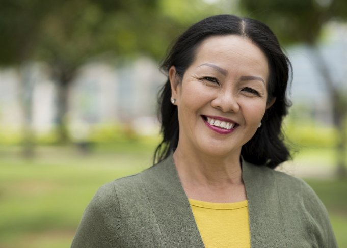 Woman standing outside and smiling