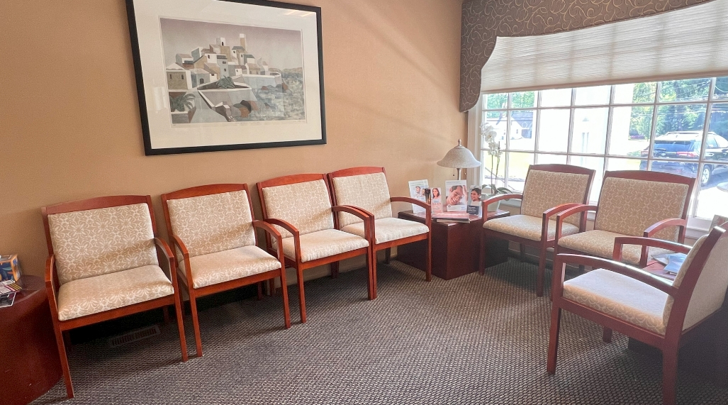 Dental office waiting room with picture on wall