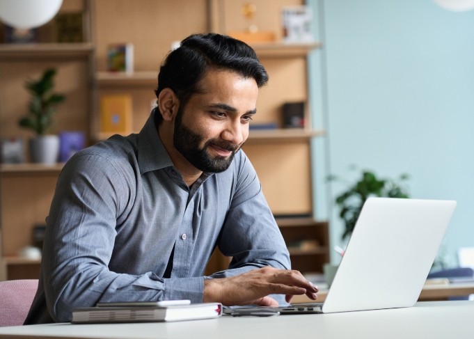 Man working on laptop at desk