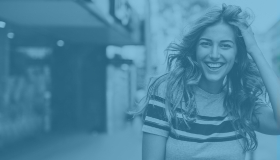 Smiling woman walking down the street