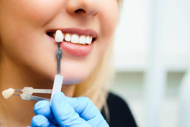 A dentist prepping a patient for cosmetic dentistry